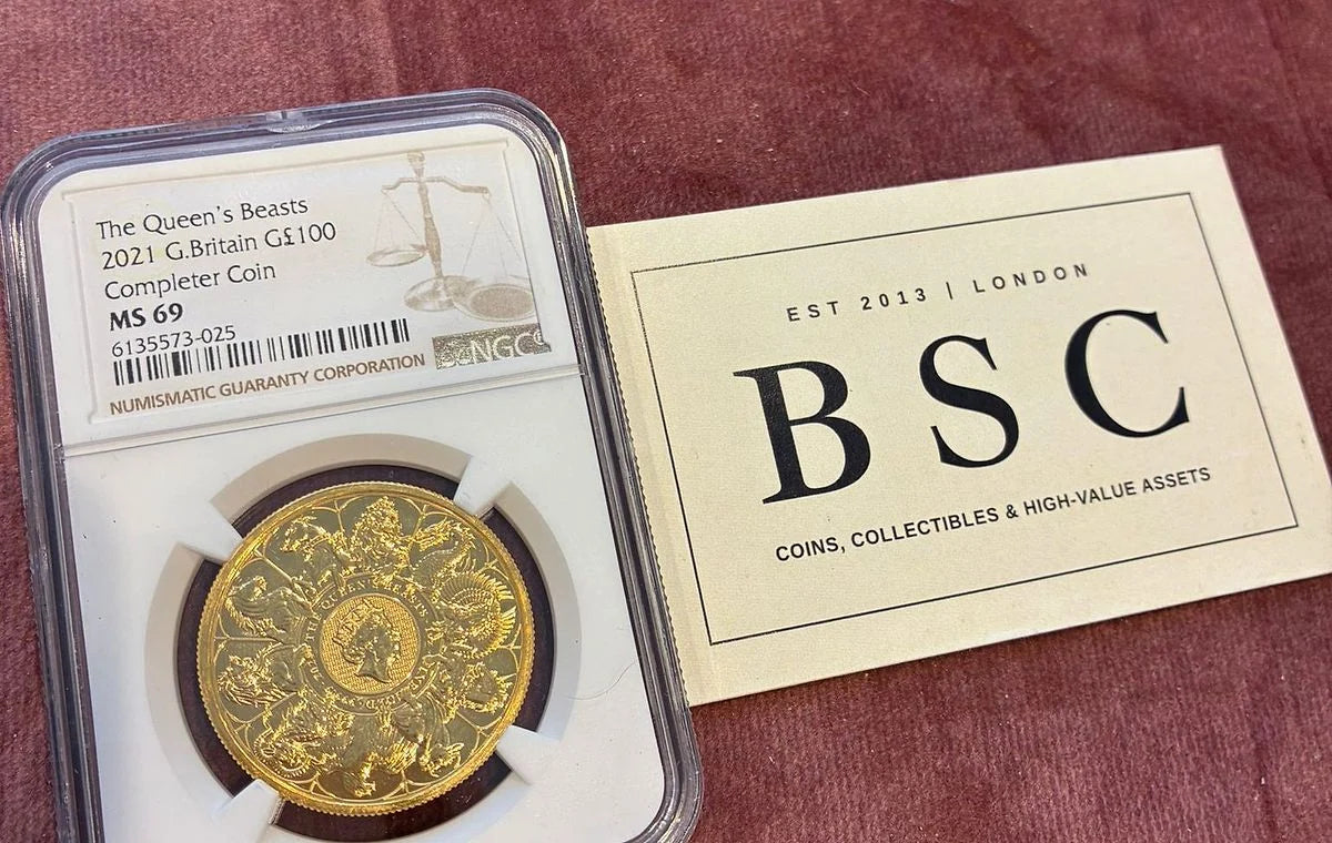 NGC graded gold coin beside a BSC Collectibles card